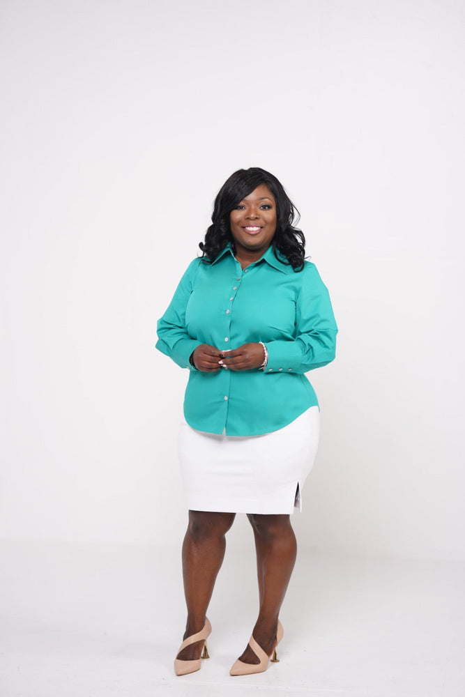 curvy business woman wearing a sophisticated button-down green shirt